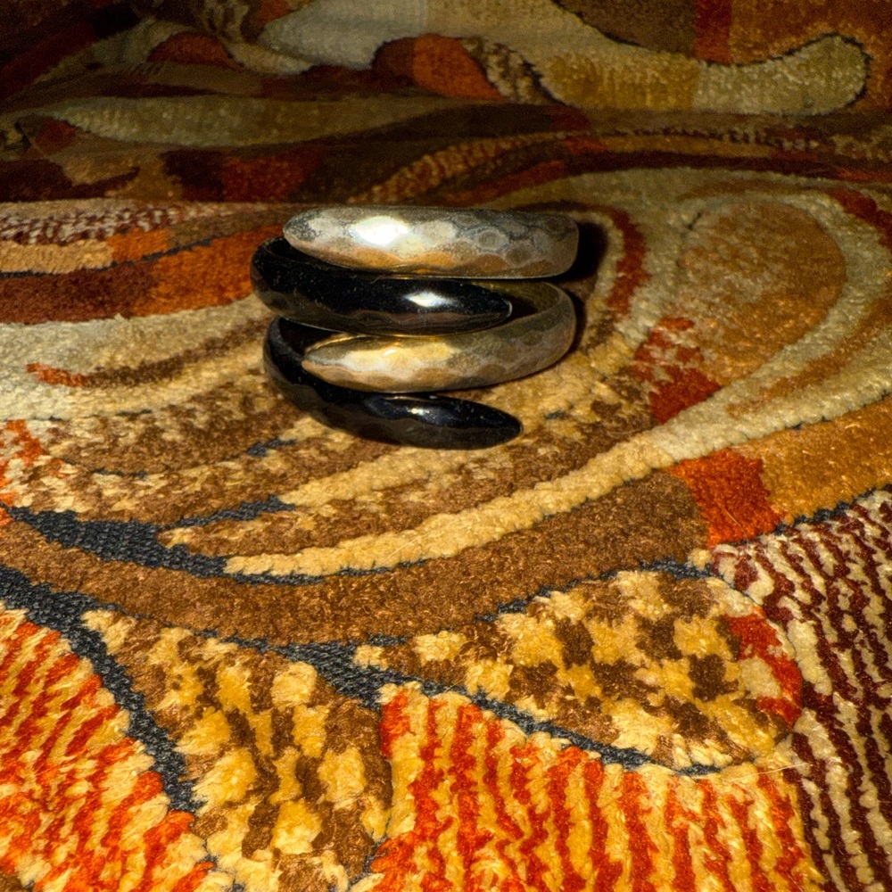 Black and gold tone bracelet that will not fall off with your wrist.